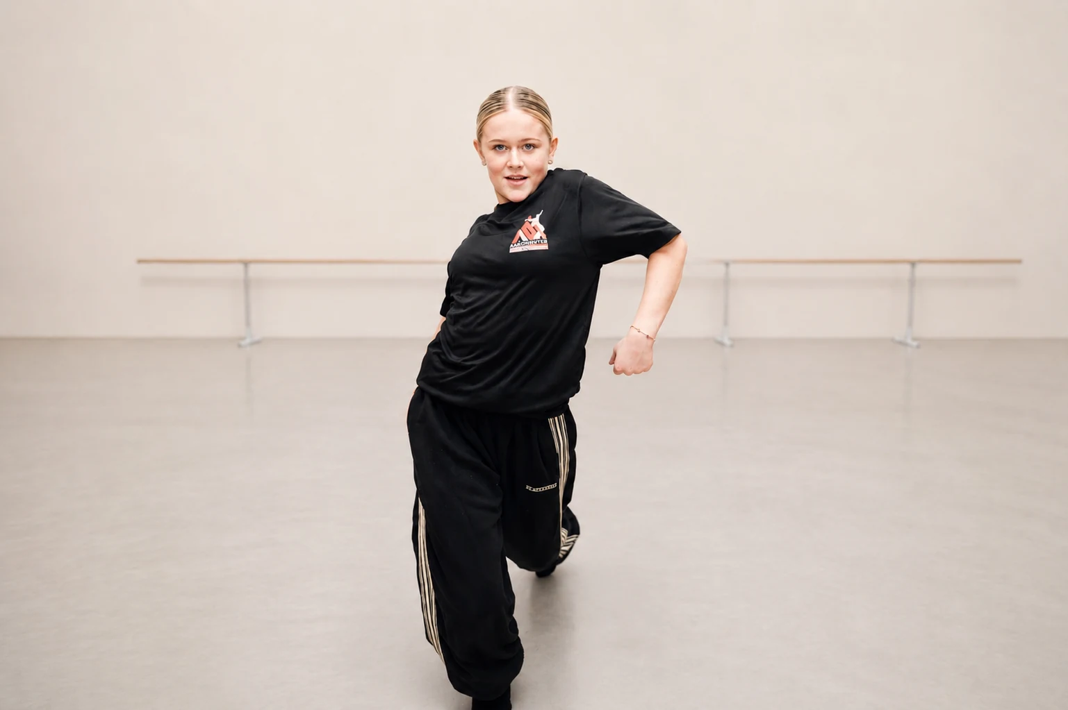 Dancer performing confidently in a studio